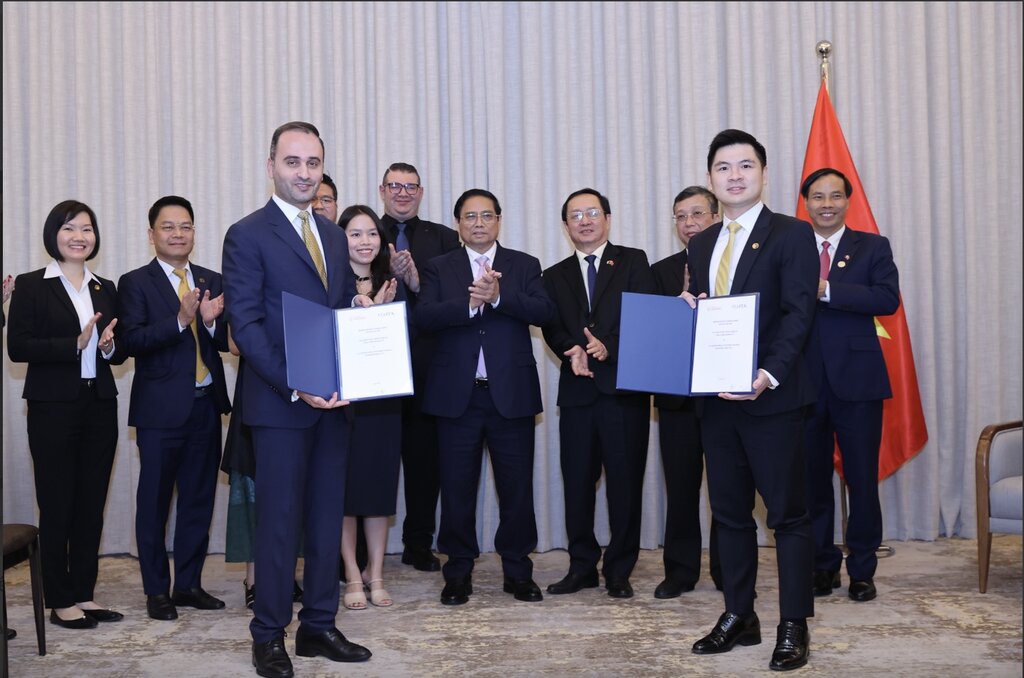 Thủ tướng Chính phủ đã chứng kiến lễ trao Biên bản thỏa thuận hợp tác nghiên cứu đầu tư vào dự án khu liên hợp thể thao và trung tâm thương mại Đông Anh giữa T&T và JTA. Ảnh: VGP